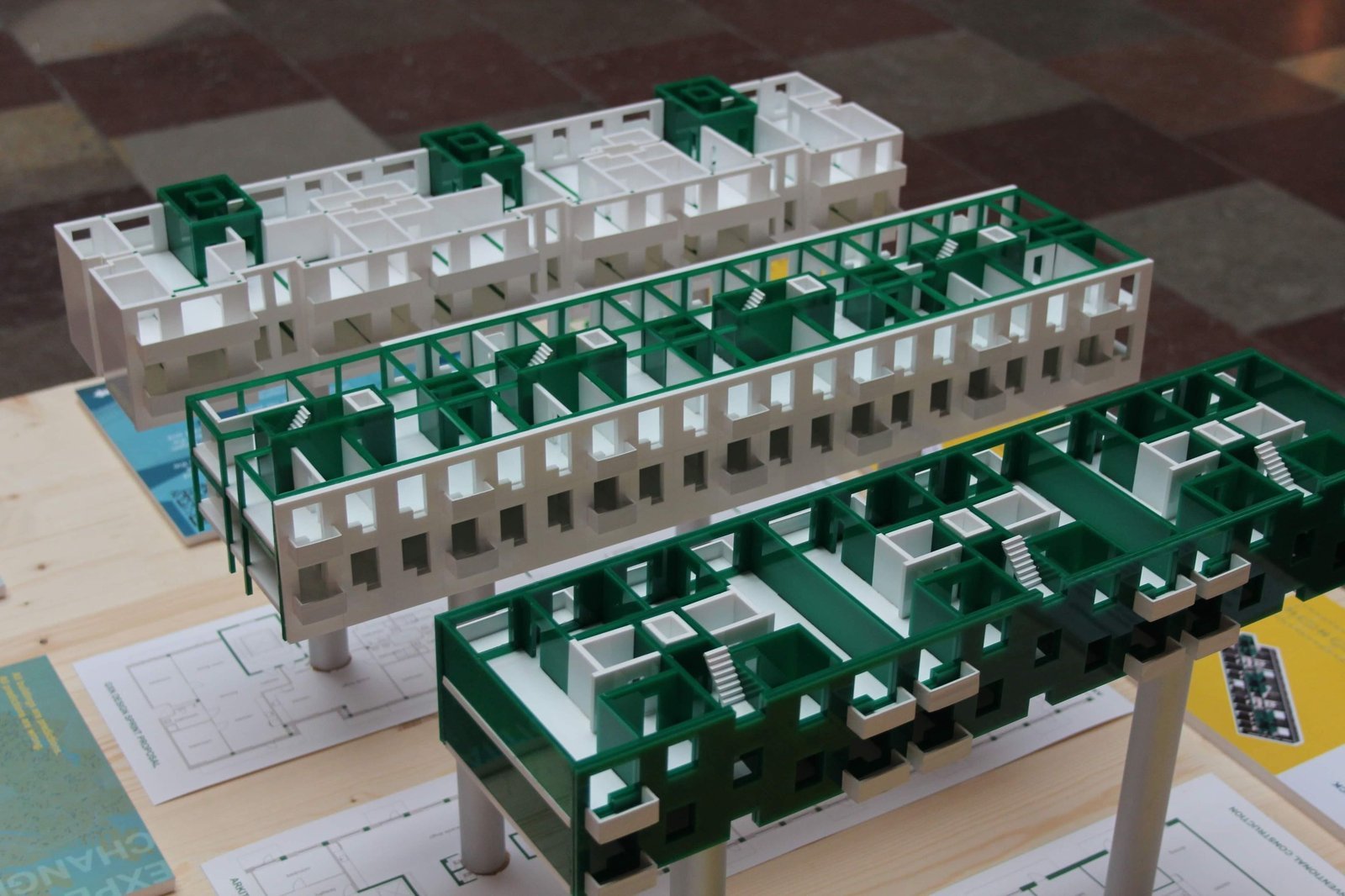 Sectional housing models in green and white